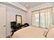 Inviting bedroom space with window view, dark desk, and charming decor at 504 N Park Ave # 3, Indianapolis, IN 46202