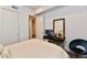 Bright bedroom space featuring a dark desk, chair, and warm lighting at 504 N Park Ave # 3, Indianapolis, IN 46202