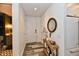 Hallway featuring modern flooring with an ornate table, decor and partial view of the kitchen at 504 N Park Ave # 3, Indianapolis, IN 46202