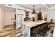 This kitchen features a central island, stainless steel appliances, and stylish countertops at 504 N Park Ave # 3, Indianapolis, IN 46202