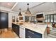 Modern kitchen with a large island, stainless steel appliances, and open floor plan at 504 N Park Ave # 3, Indianapolis, IN 46202