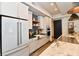 Bright kitchen with stainless steel appliances, white cabinets and a central island at 504 N Park Ave # 3, Indianapolis, IN 46202