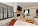 Cozy living room featuring a modern fireplace, ample seating, and bright light at 504 N Park Ave # 3, Indianapolis, IN 46202