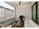 Inviting outdoor balcony with grill and furniture for relaxing and entertaining at 504 N Park Ave # 3, Indianapolis, IN 46202