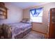 Bedroom features comfortable bed with bright window and built in shelf at 535 Butterfly Cir, Greenwood, IN 46142