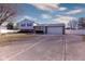 Wide concrete driveway leading to a two-car garage and a well maintained home at 535 Butterfly Cir, Greenwood, IN 46142