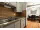 Kitchen featuring stainless steel sink with view into the adjoining dining space at 535 Butterfly Cir, Greenwood, IN 46142