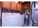 Functional laundry room features a washer, dryer, water heater, and cabinets at 535 Butterfly Cir, Greenwood, IN 46142