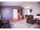 Inviting living room with hardwood floors, a barn door accent, and comfortable seating at 535 Butterfly Cir, Greenwood, IN 46142