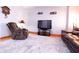 Comfortable living room featuring hardwood floors, neutral paint, and cozy furnishings at 535 Butterfly Cir, Greenwood, IN 46142