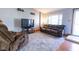 Cozy living room featuring hardwood floors, neutral walls, and comfortable seating at 535 Butterfly Cir, Greenwood, IN 46142