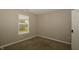 This cozy bedroom is complete with neutral walls, carpet, and natural light offering a blank canvas for personalization at 5406 Shamus Dr, Indianapolis, IN 46235