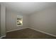 Well-lit bedroom with neutral walls, providing a blank canvas and window for a cozy, personalized living space at 5406 Shamus Dr, Indianapolis, IN 46235