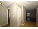 Hallway featuring neutral paint, vinyl floors, and doors leading to other rooms in the home at 5406 Shamus Dr, Indianapolis, IN 46235