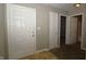 Inviting entryway featuring neutral walls and white doors, offering a bright and clean transition into the home at 5406 Shamus Dr, Indianapolis, IN 46235