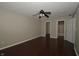 Main bedroom offering wood floors, a ceiling fan, and ensuite access at 5406 Shamus Dr, Indianapolis, IN 46235