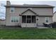 Backyard featuring a screened in porch and patio with outdoor seating at 561 Prince Dr, Greenwood, IN 46142