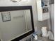 Well-lit bathroom with a modern mirror, vanity, and storage shelves offering style and functionality at 561 Prince Dr, Greenwood, IN 46142
