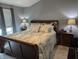 Serene bedroom with a luxurious bed, neutral decor, and soft lighting for a relaxing retreat at 561 Prince Dr, Greenwood, IN 46142