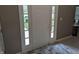 Interior view of front door with sidelights and decorative rug at 561 Prince Dr, Greenwood, IN 46142