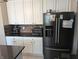 Kitchen features stainless steel appliances, granite countertops, and white cabinets at 561 Prince Dr, Greenwood, IN 46142