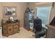 Office area with safe, cabinet, and view of window and artwork at 561 Prince Dr, Greenwood, IN 46142