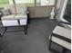 Cozy screened-in patio featuring a comfortable sofa, chair, and coffee table for outdoor relaxation at 561 Prince Dr, Greenwood, IN 46142