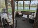 Relaxing sunroom featuring comfortable seating and scenic lake views at 561 Prince Dr, Greenwood, IN 46142