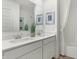 Bathroom featuring dual sinks and an enclosed bathtub at 5809 Sunstone Rd, Indianapolis, IN 46239