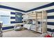 bedroom with blue and white stripes, a bunk bed, and beanbag chair at 5809 Sunstone Rd, Indianapolis, IN 46239
