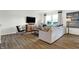 Cozy living room featuring hardwood floors, comfortable seating, and bright windows at 5809 Sunstone Rd, Indianapolis, IN 46239