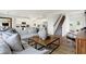 Open-concept living room flows into a modern kitchen and features a staircase at 5809 Sunstone Rd, Indianapolis, IN 46239