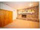 Cozy finished basement with brick fireplace, mantel, and closet at 5918 Camelback Ct, Indianapolis, IN 46250