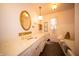 Charming bathroom featuring a decorative sink, and a soaking tub at 5918 Camelback Ct, Indianapolis, IN 46250