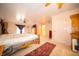 Spacious bedroom featuring a ceiling fan, area rug, and ample natural light at 5918 Camelback Ct, Indianapolis, IN 46250
