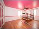 Cozy bedroom featuring wood floors, ceiling fan and decorative design at 5918 Camelback Ct, Indianapolis, IN 46250