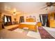 Bright bedroom with light-colored walls, hardwood furniture, and a ceiling fan at 5918 Camelback Ct, Indianapolis, IN 46250