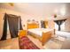 Spacious bedroom with hardwood furniture, light-colored walls, and soft natural light at 5918 Camelback Ct, Indianapolis, IN 46250
