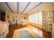 Bright dining room with light hardwood floors and large windows at 5918 Camelback Ct, Indianapolis, IN 46250