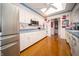 Bright kitchen with white cabinetry, hardwood floors, and stainless steel appliances at 5918 Camelback Ct, Indianapolis, IN 46250