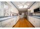 Well-lit kitchen with white cabinets, hardwood floors, and modern appliances at 5918 Camelback Ct, Indianapolis, IN 46250