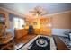 A quaint office space with hardwood floors, a zebra-print rug, and unique overhead fan at 5918 Camelback Ct, Indianapolis, IN 46250