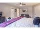 Spacious bedroom featuring a queen bed with a white comforter and purple throw blanket at 633 Foxboro Dr, Avon, IN 46123