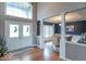 Elegant dining room featuring hardwood floors, large windows, and stylish furniture at 633 Foxboro Dr, Avon, IN 46123