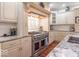 Gourmet kitchen featuring high-end appliances, custom cabinetry, and granite countertops at 633 Foxboro Dr, Avon, IN 46123