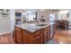 Open kitchen with a central island, modern appliances, and seamless connection to the living space at 633 Foxboro Dr, Avon, IN 46123