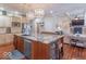 Spacious kitchen with a large island, stainless steel appliances, and open layout to the living area at 633 Foxboro Dr, Avon, IN 46123