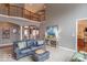 Open-concept living room with seamless flow to the dining area and elegant furnishings at 633 Foxboro Dr, Avon, IN 46123