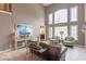 Elegant living room with large windows providing natural light, complemented by tasteful decor at 633 Foxboro Dr, Avon, IN 46123