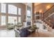 Bright living room with large windows, a fireplace, and comfortable seating at 633 Foxboro Dr, Avon, IN 46123